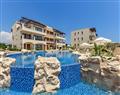 Enjoy a glass of wine at Apartment Alexander Heights Premium AN01; Aphrodite Hills; Cyprus