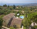 Enjoy a glass of wine at Olive Mill Villa; Kefalonia; Greece