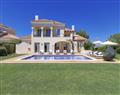 Enjoy a glass of wine at Villa Genoveva II; Monte Rei Golf & Country Club; Portugal