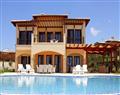 Enjoy a glass of wine at Villa Natalya; Aphrodite Hills; Cyprus