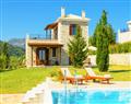 Enjoy a glass of wine at Villa Nisa; Lefkas; Greece