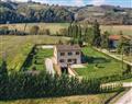 Enjoy a glass of wine at Villa Podere Pavone; Volterra; Tuscany