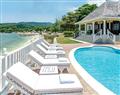 Enjoy a glass of wine at Villa Reveille; The Tyrall Club, Montego Bay; Jamaica