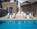 Enjoy a glass of wine at Adonis Villas; Panormos Beach; Mykonos
