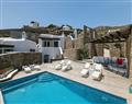 Enjoy a glass of wine at Ajax Villas; Panormos Beach; Mykonos