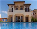 Enjoy a glass of wine at Elite Superior Villa Opal; Aphrodite Hills Resort; Paphos