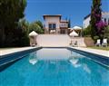 Enjoy a glass of wine at Elite Superior Villa Tranquil; Aphrodite Hills Resort; Paphos