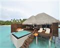 Enjoy a glass of wine at Ocean Moon Villa; Ayada; Maldives
