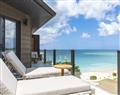 Enjoy a glass of wine at Ocean View Suite; Antigua; Caribbean