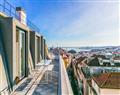 Enjoy a glass of wine at Os Lusiadas Apartment; Lisbon; Portugal