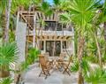 Enjoy a glass of wine at Soliman Bay Bungalow 2; Tulum; Mexico