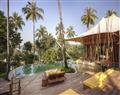 Enjoy a glass of wine at Soneva Beach Pool Villa Suite; Soneva Kiri; Thailand