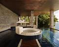 Enjoy a glass of wine at Spa Pool Suite; Paresa Resort; Thailand