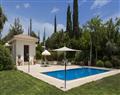 Enjoy a glass of wine at Superior Villa Ocean; Aphrodite Hills Resort; Paphos