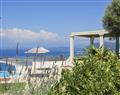 Enjoy a glass of wine at Villa Agios; Lefkas; Greece