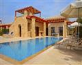 Enjoy a glass of wine at Villa Axis; Aphrodite Hills; Cyprus