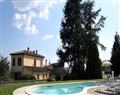 Enjoy a glass of wine at Villa Roccoletta; Arezzo; Tuscany