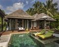 Enjoy a glass of wine at Villa Sapphire Pool; Anantara Kihavah; Maldives
