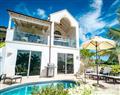 Enjoy a glass of wine at Villa Sugar Cane Golf; Royal Westmoreland; Barbados