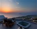 Enjoy a glass of wine at Villa Vinea; Santorini; Greece